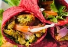 Kabuli Chana Tikki Wrap with Creamy Kashmiri Chili–Cashew Sauce in a Soft Beetroot Roti