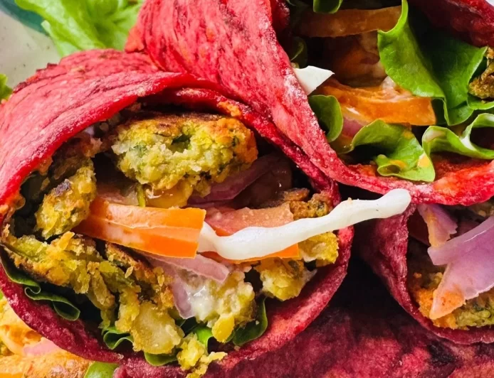 Kabuli Chana Tikki Wrap with Creamy Kashmiri Chili–Cashew Sauce in a Soft Beetroot Roti